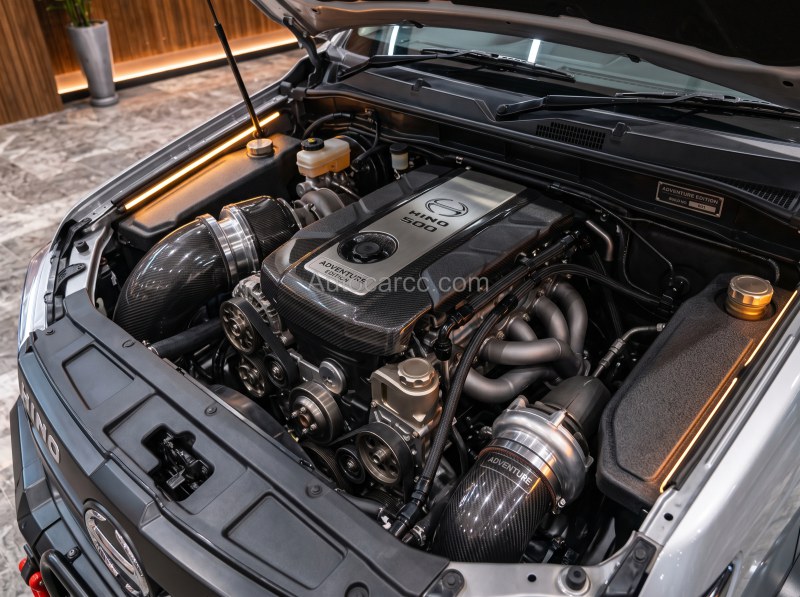 2027 Hino 500 Adventure new offroad mini pickup concept engine bay with Hino cover and dual intake setup