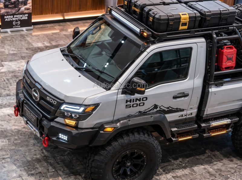 2027 Hino 500 Adventure new offroad mini pickup concept high front three-quarter view with roof cargo boxes