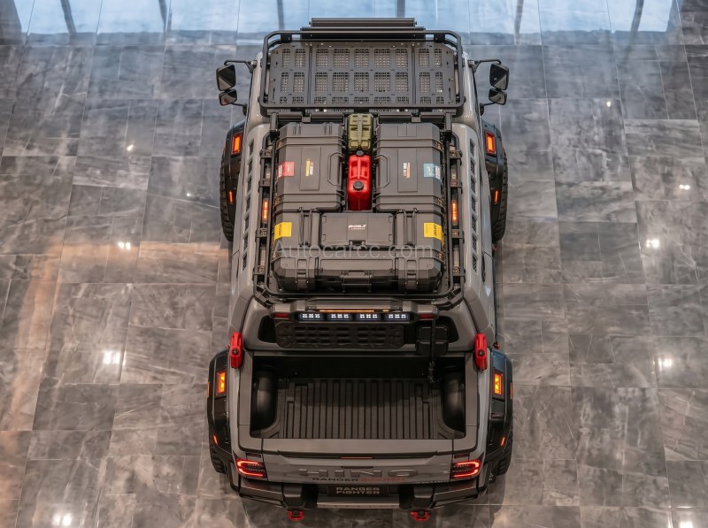 2027 Hino Ranger Fighter overhead view of short pickup bed roof cases and red fuel can