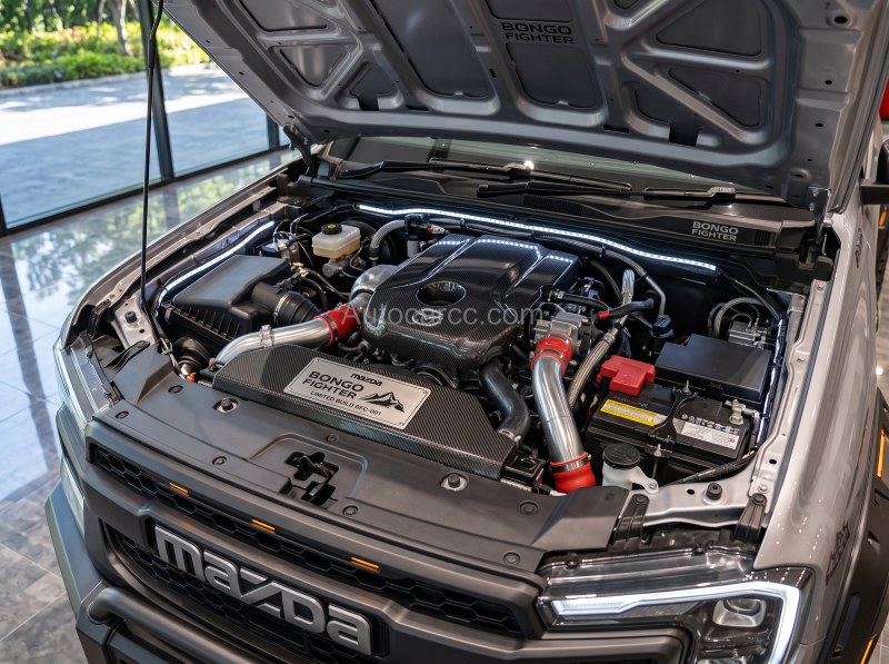 2027 Mazda Bongo Fighter Pickup Offroad engine bay with Mazda cover and red intake piping