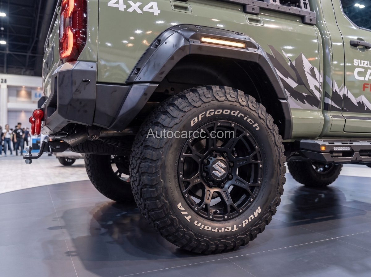 2027 Suzuki Carry Fighter Concept rear wheel close-up with BFGoodrich Mud-Terrain tire and black alloy wheel