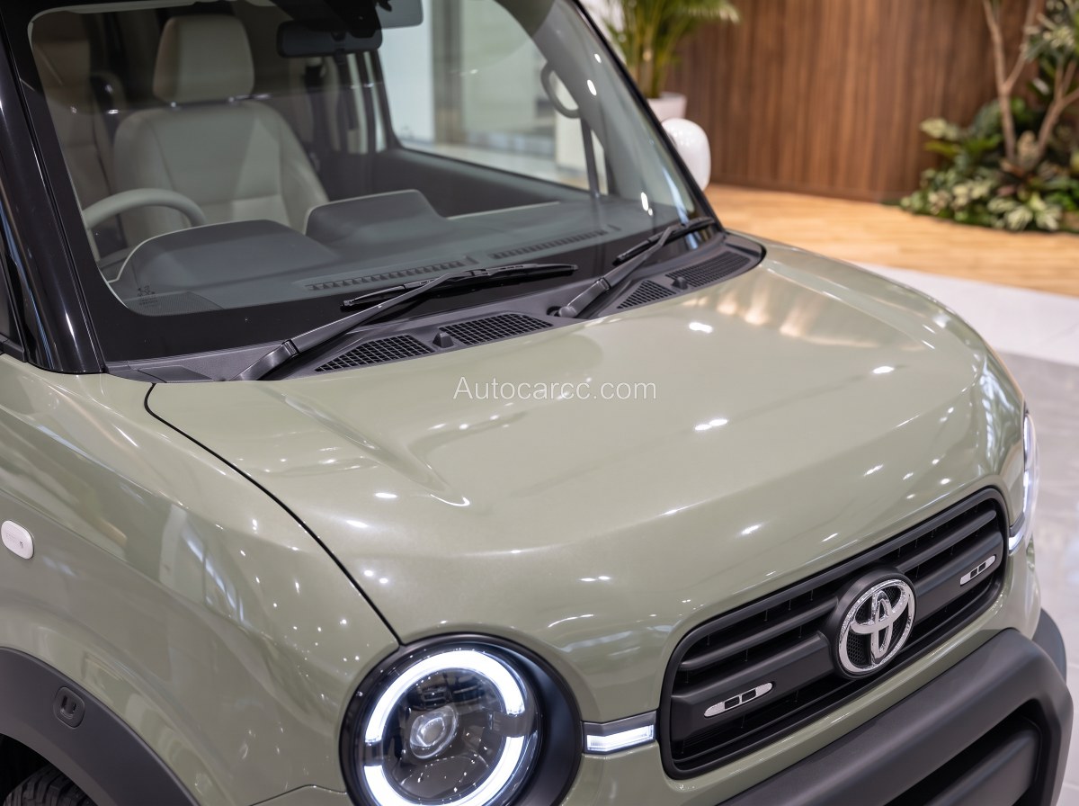 2027 Toyota Mini Camper Concept hood and front windshield detail with Toyota grille